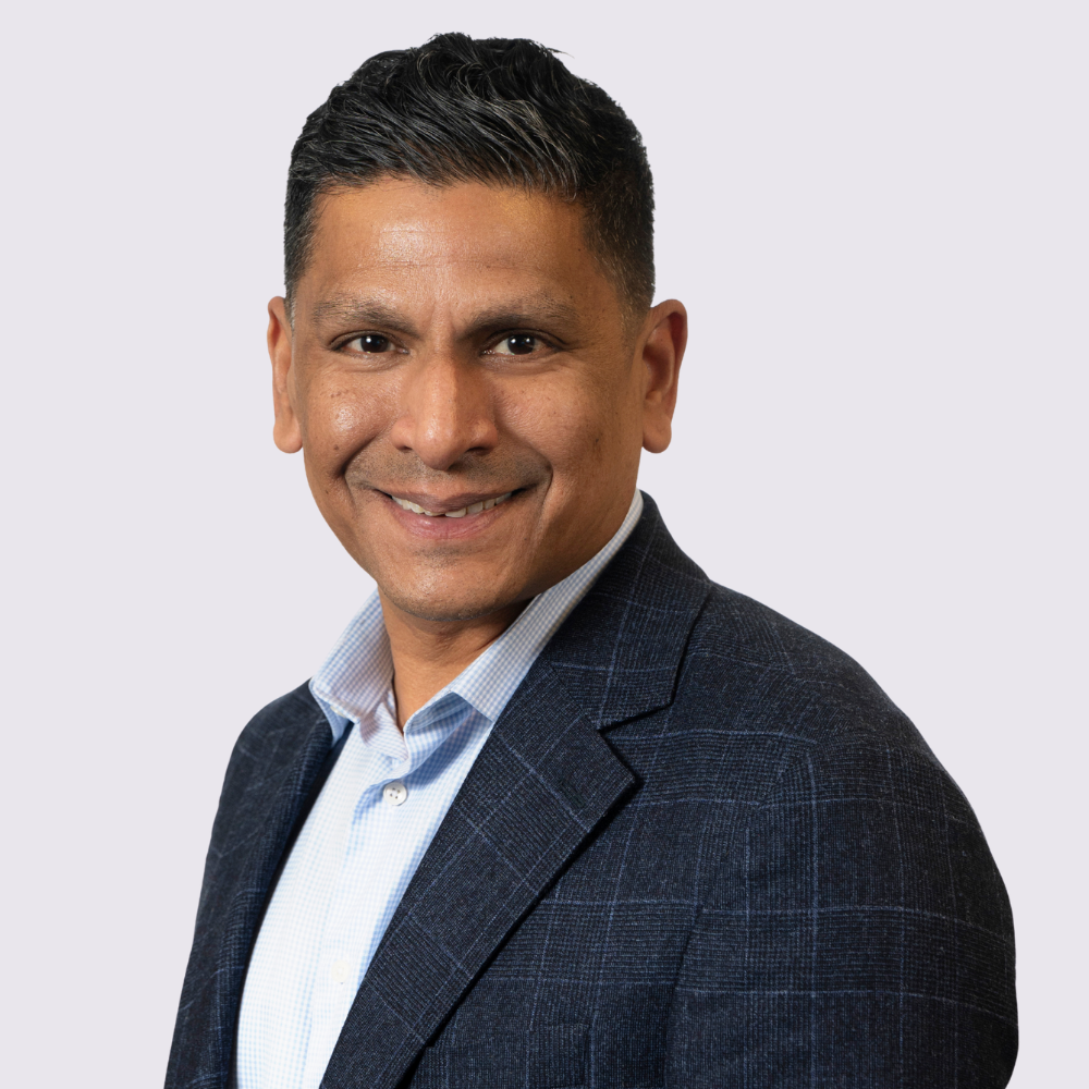 Headshot of Ashok Sinha.