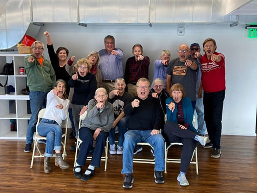 Dane Stauffer (pictured far right), with students during an improv class at Theatre 55 in Minnesota.