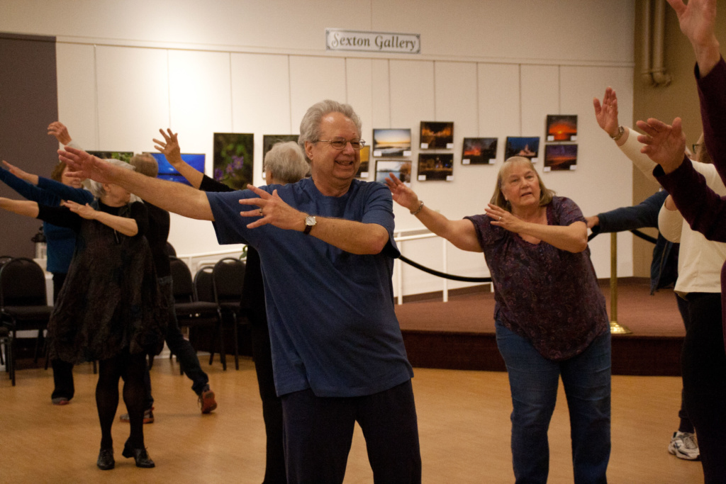 Dance instructor David DeBlieck leaps across the studio floor.