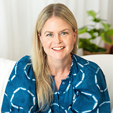Headshot of Heather Ikemire. She has long blonde hair and light green eyes. She is smiling.